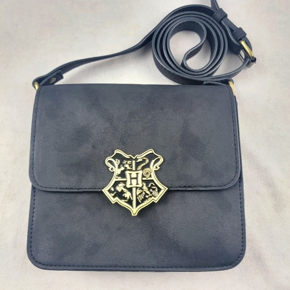 Warner Bros. Handbags - Harry Potter Hogwarts Crest crossbody handbag 7.5" x 7" x 2"